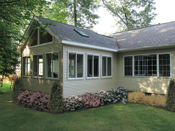 Exterior of a sunroom addition with fresh landscaping — MDR Design-Build-Remodel