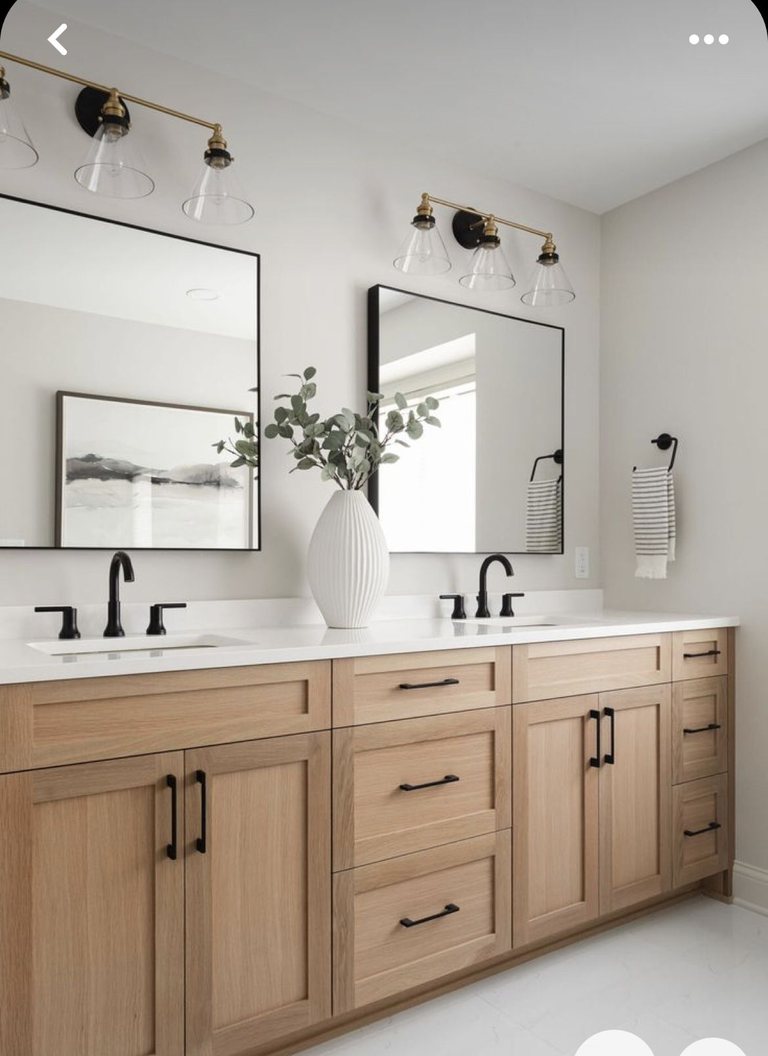 Master bathroom with a natural-wood double vanity and black hardware — MDR Design-Build-Remodel