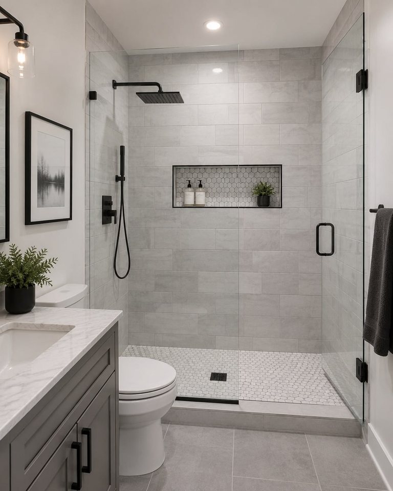 Walk-in tile shower with a built-in niche and black fixtures — MDR Design-Build-Remodel