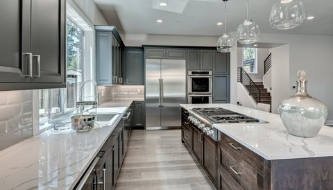 White kitchen remodel with center island by MDR Design-Build-Remodel