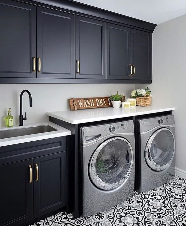 Laundry room with dark cabinets and patterned floor tile — MDR Design-Build-Remodel
